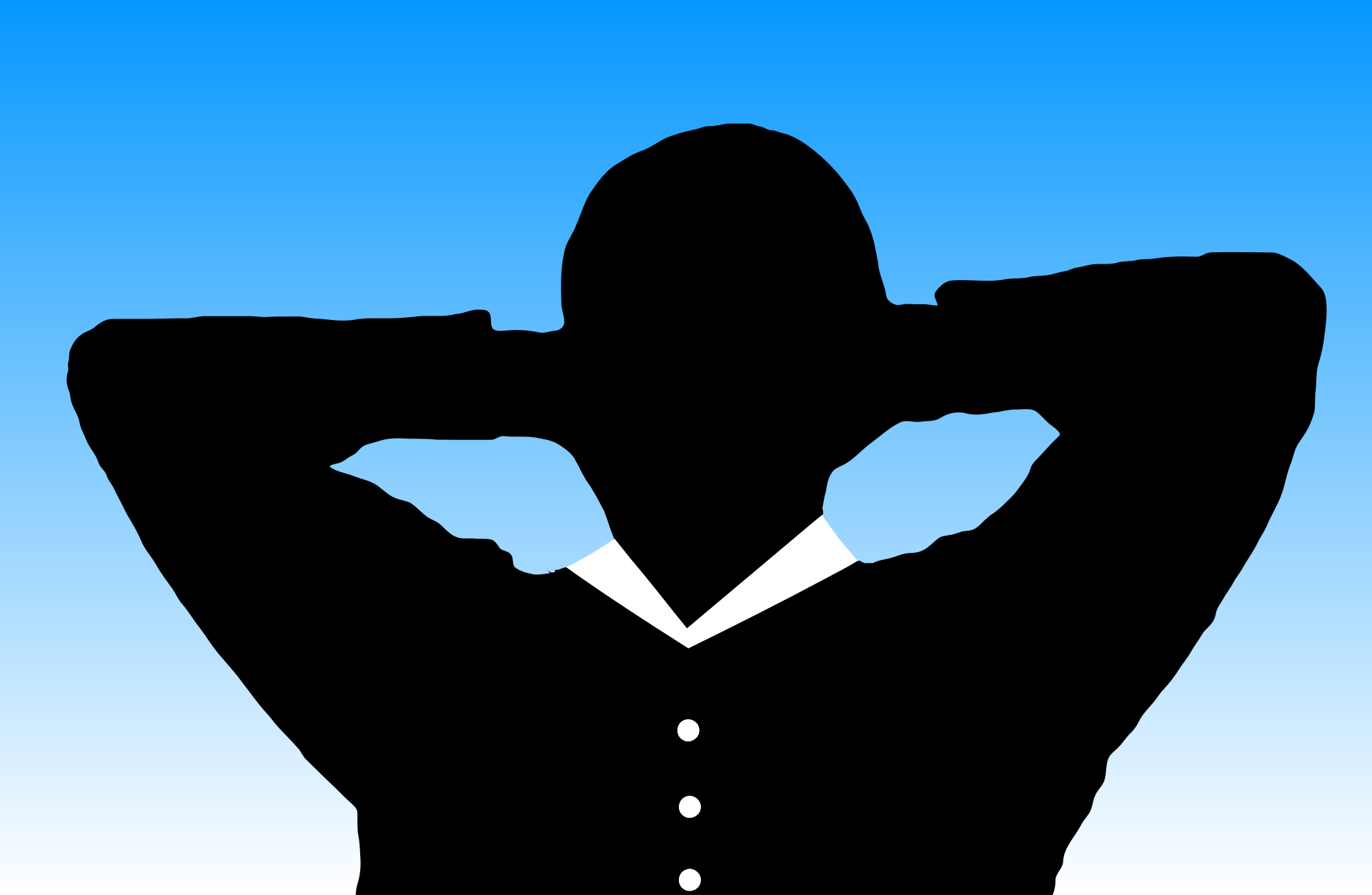 Silouettte of a man leaning back in a chair